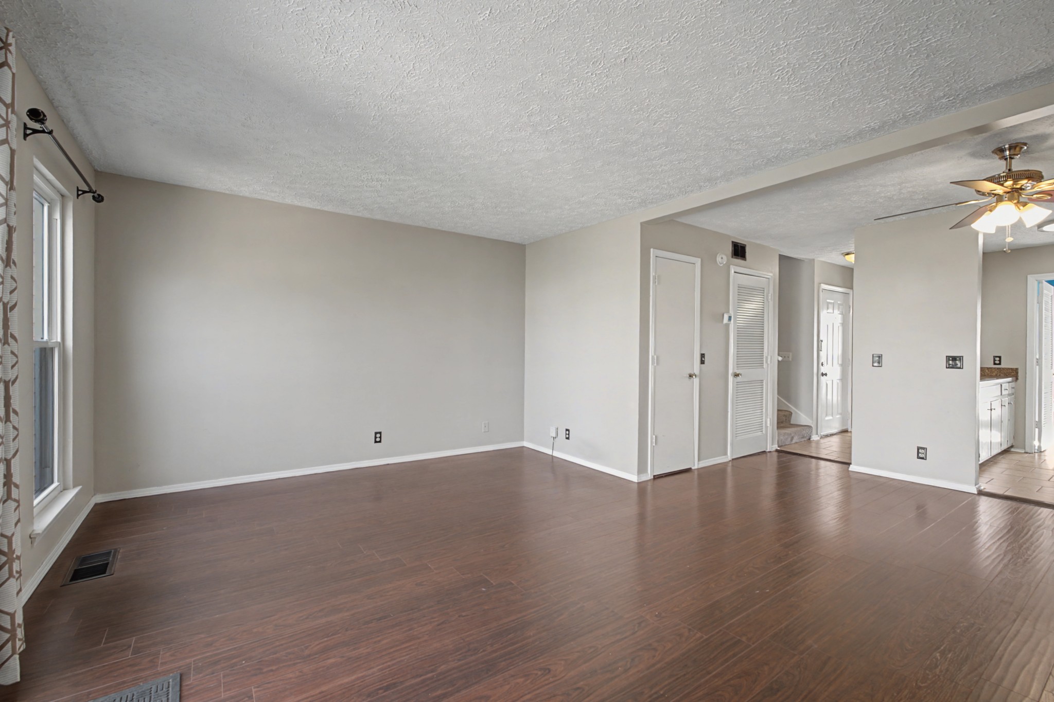 4316 Baton Rouge Drive Hermitage, TN 37076 - Photo 3 of 20 a view of an empty room with wooden floor and a window