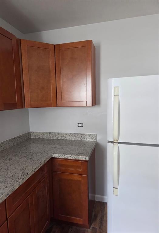 31 Edmund Road, Unit 1 West Park, FL 33023 - Photo 5 of 9 a kitchen with stainless steel appliances granite countertop a refrigerator and a sink