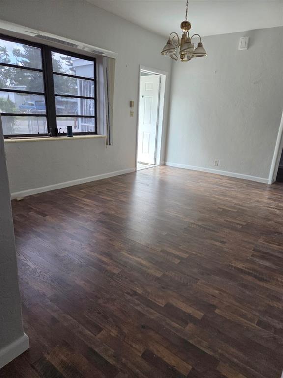 31 Edmund Road, Unit 1 West Park, FL 33023 - Photo 7 of 9 wooden floor in an empty room with a window