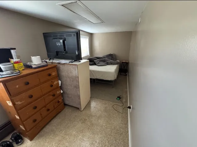 a room with a couch and a stove top oven