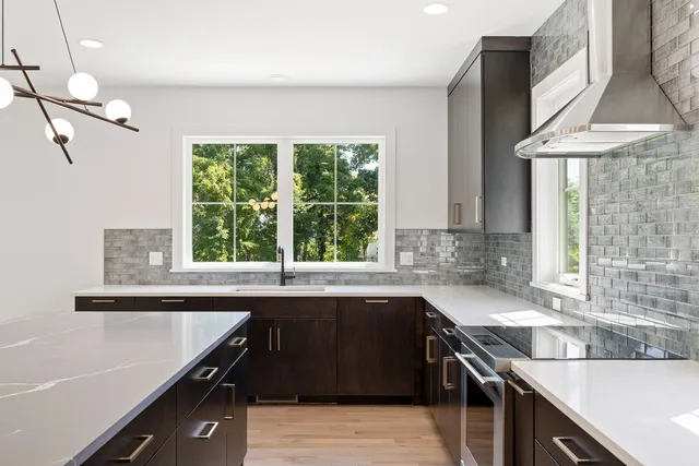 a kitchen with a sink and a window