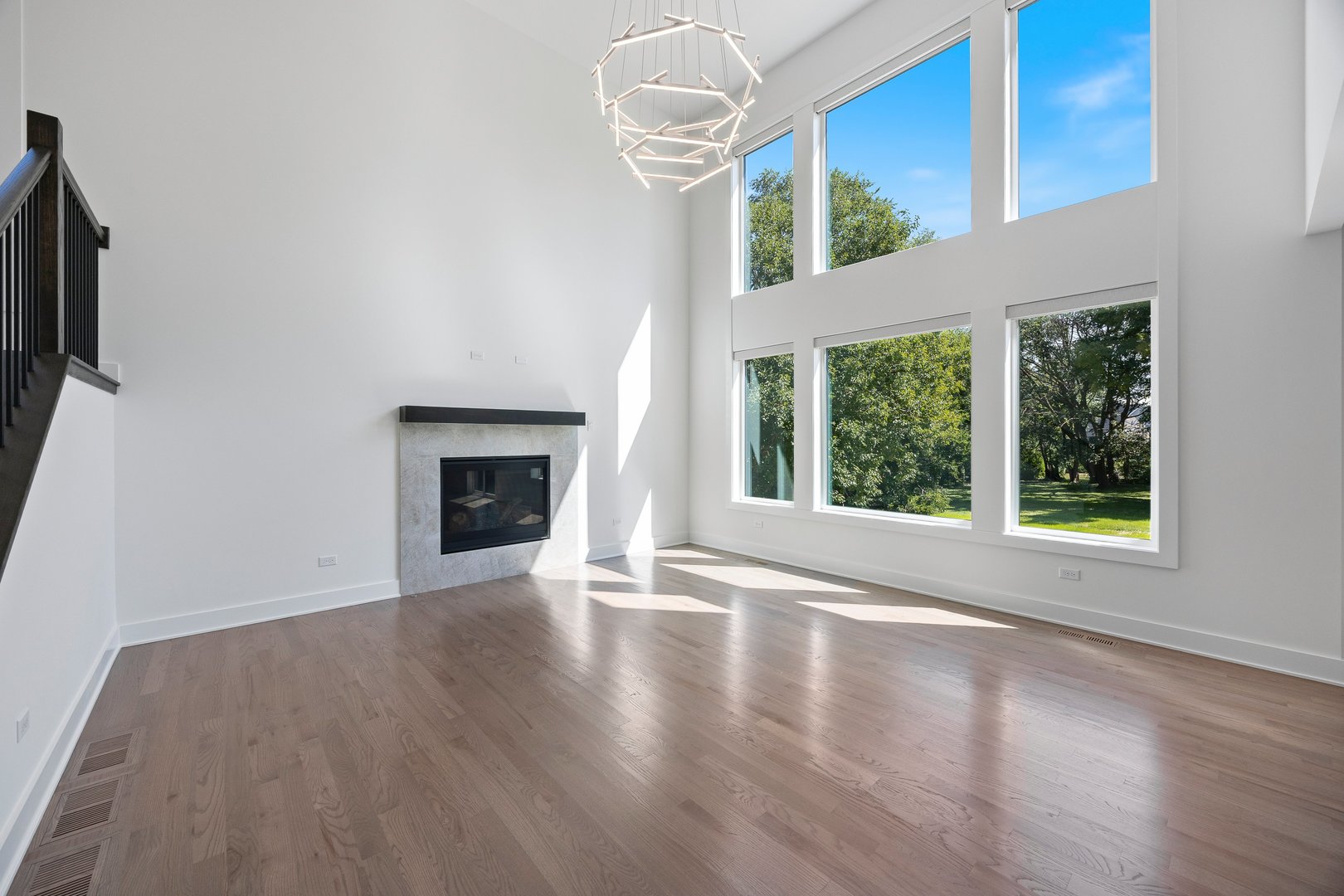 1519 Foothill Drive Wheaton, IL 60189 - Photo 15 of 43 a view of an empty room with wooden floor fireplace and a window