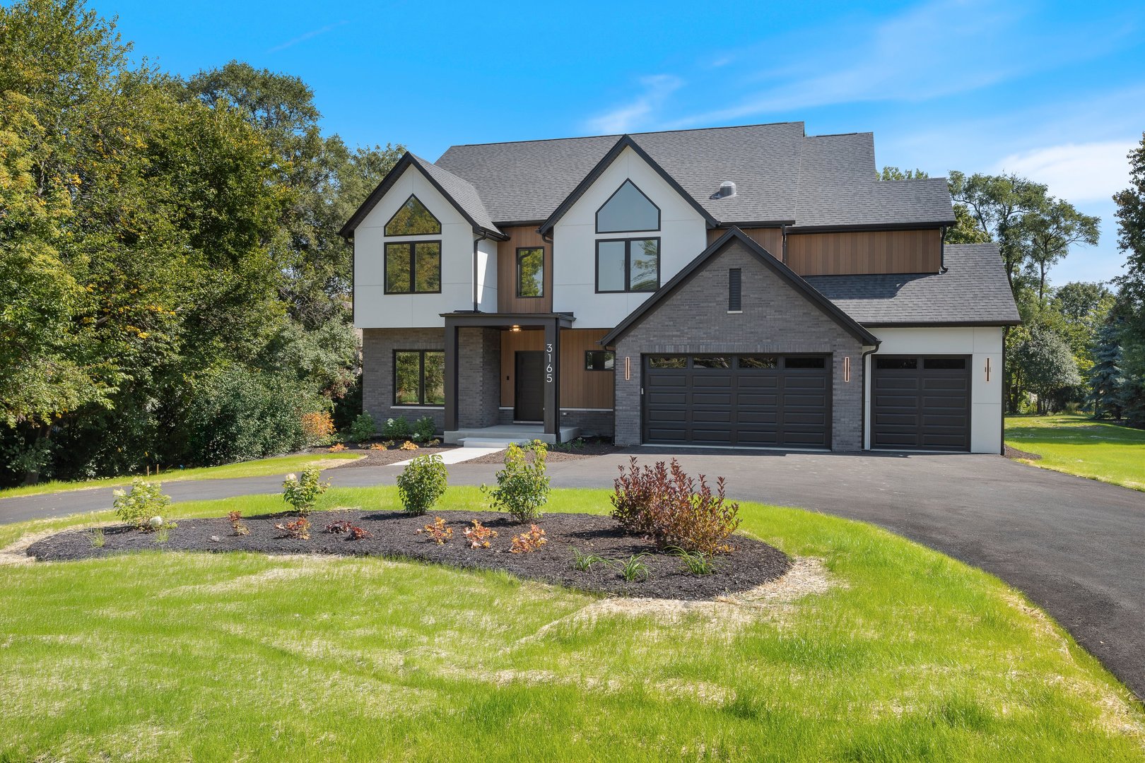 1519 Foothill Drive Wheaton, IL 60189 - Photo 2 of 43 a front view of a house with a yard outdoor seating and garage