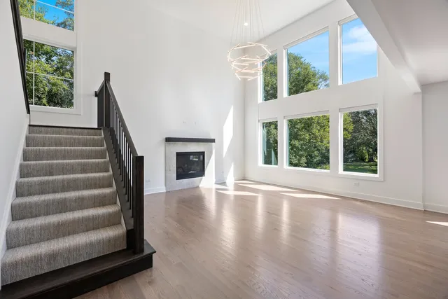 a view of an entryway with wooden floor and a floor to ceiling window