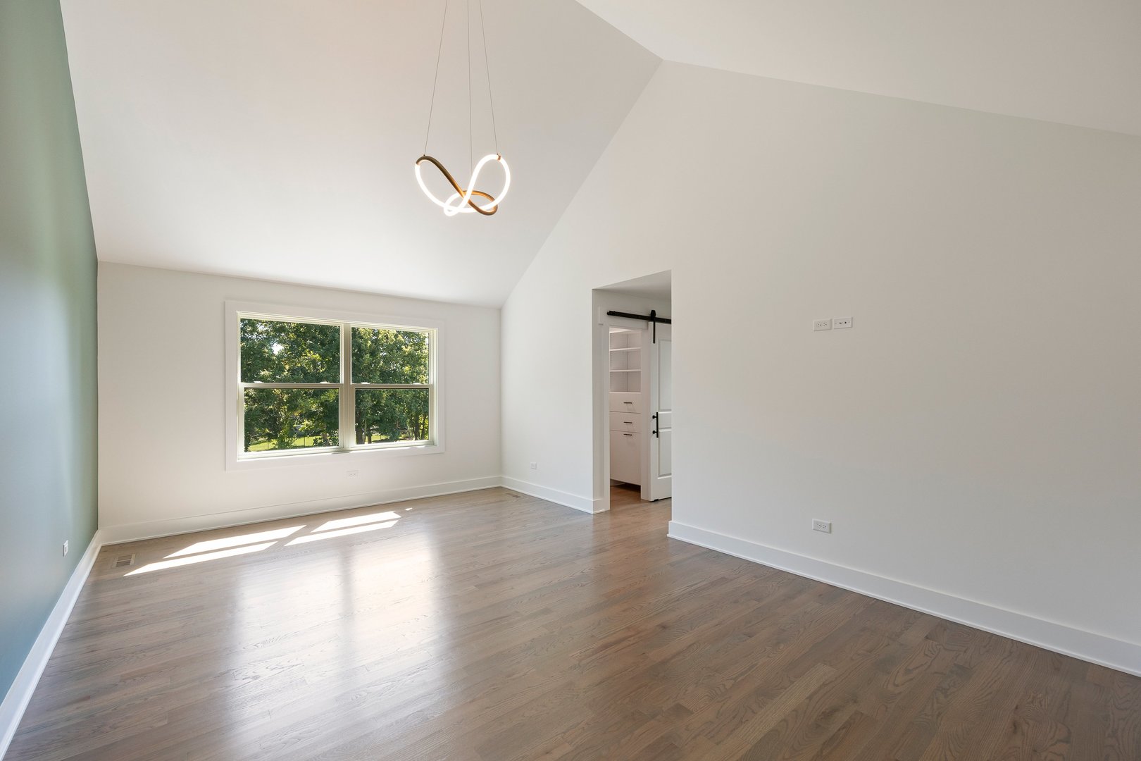 1519 Foothill Drive Wheaton, IL 60189 - Photo 25 of 43 an empty room with wooden floor and windows