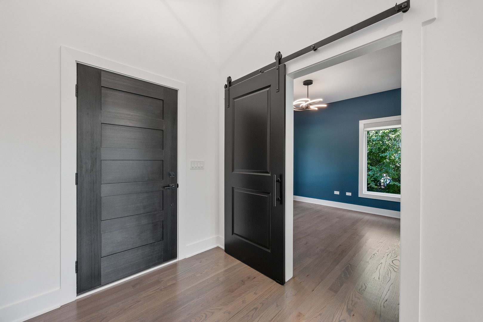 1519 Foothill Drive Wheaton, IL 60189 - Photo 26 of 43 an empty room with wooden floor mirror and windows