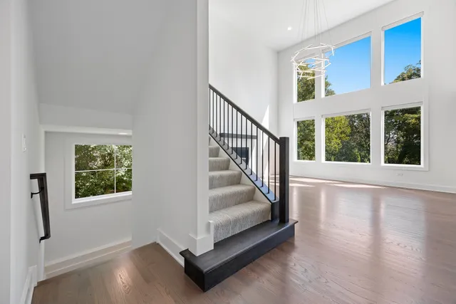 a view of an entryway with wooden floor