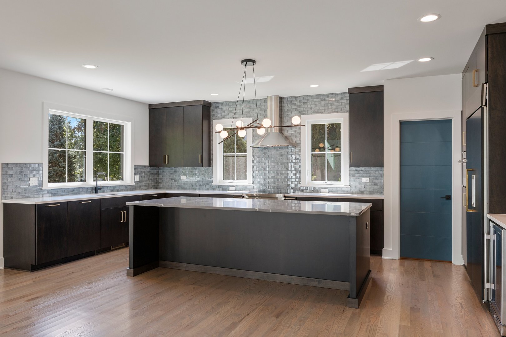 1519 Foothill Drive Wheaton, IL 60189 - Photo 8 of 43 a kitchen with stainless steel appliances granite countertop a sink and wooden floor