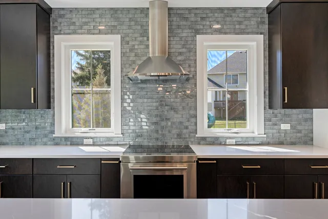 a kitchen with a sink and cabinets