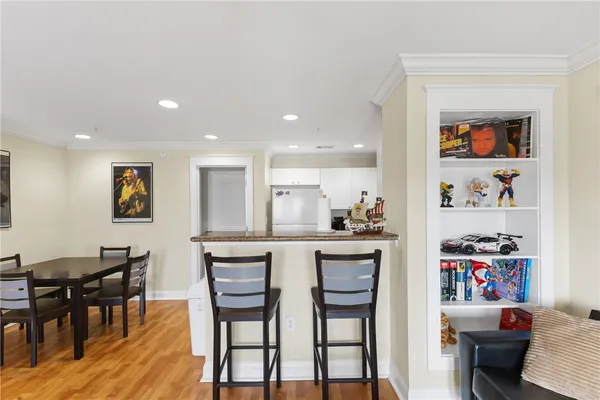 a view of a dining room with furniture and wooden floor