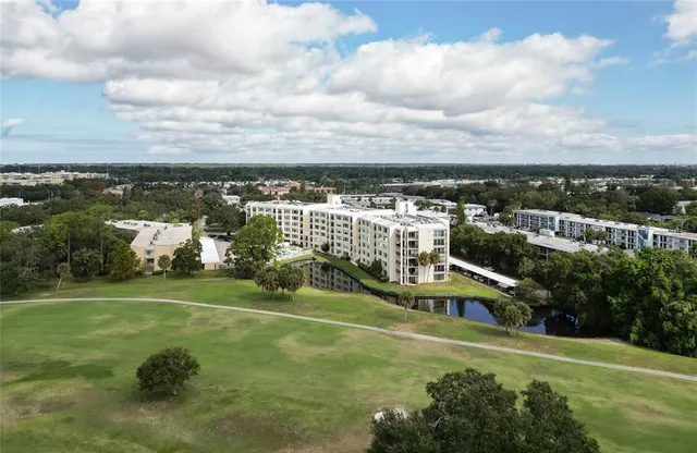 a view of a city with lawn chairs and iron fence