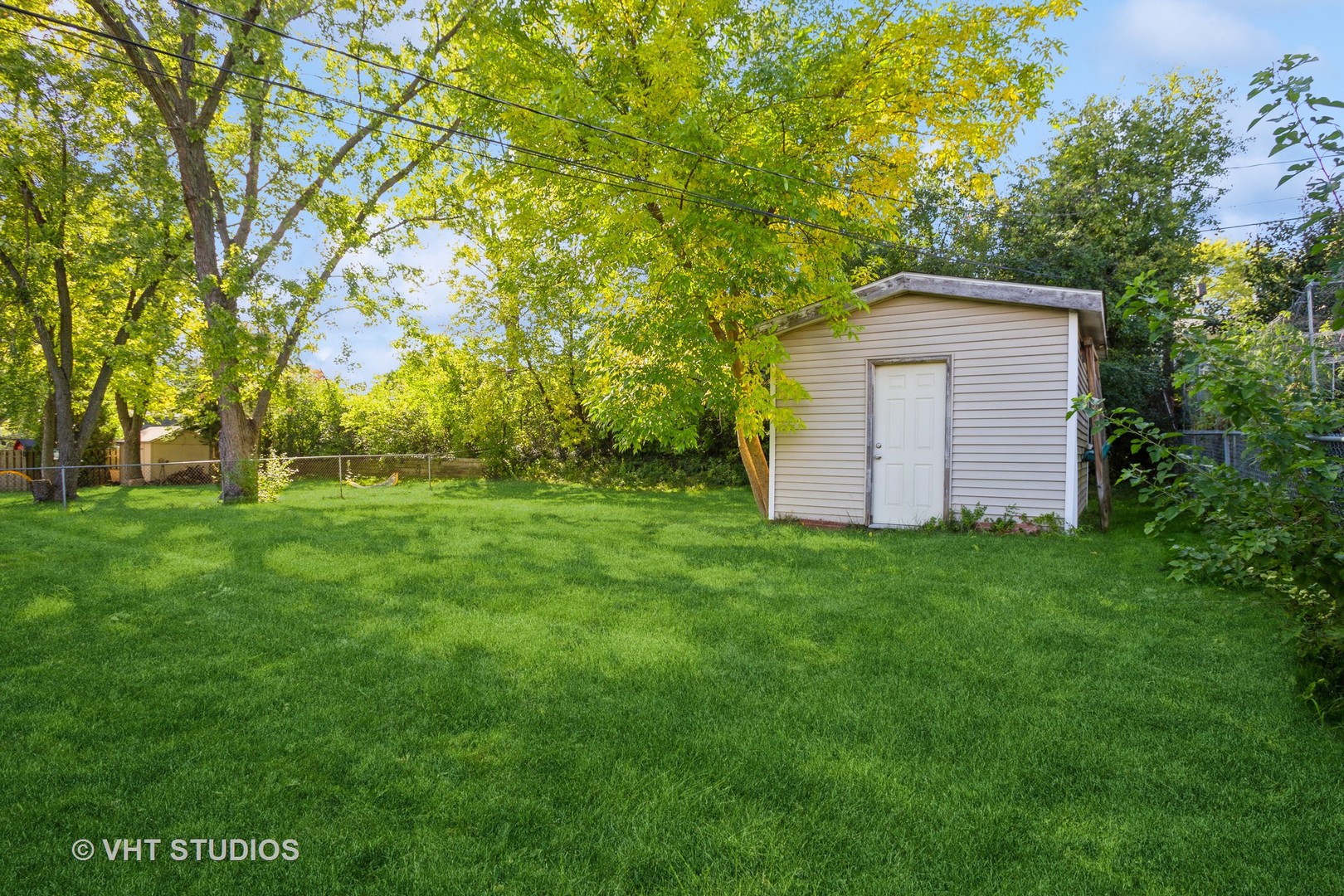 1710 Pierce Road Hoffman Estates, IL 60169 - Photo 12 of 12 a view of a backyard with large trees