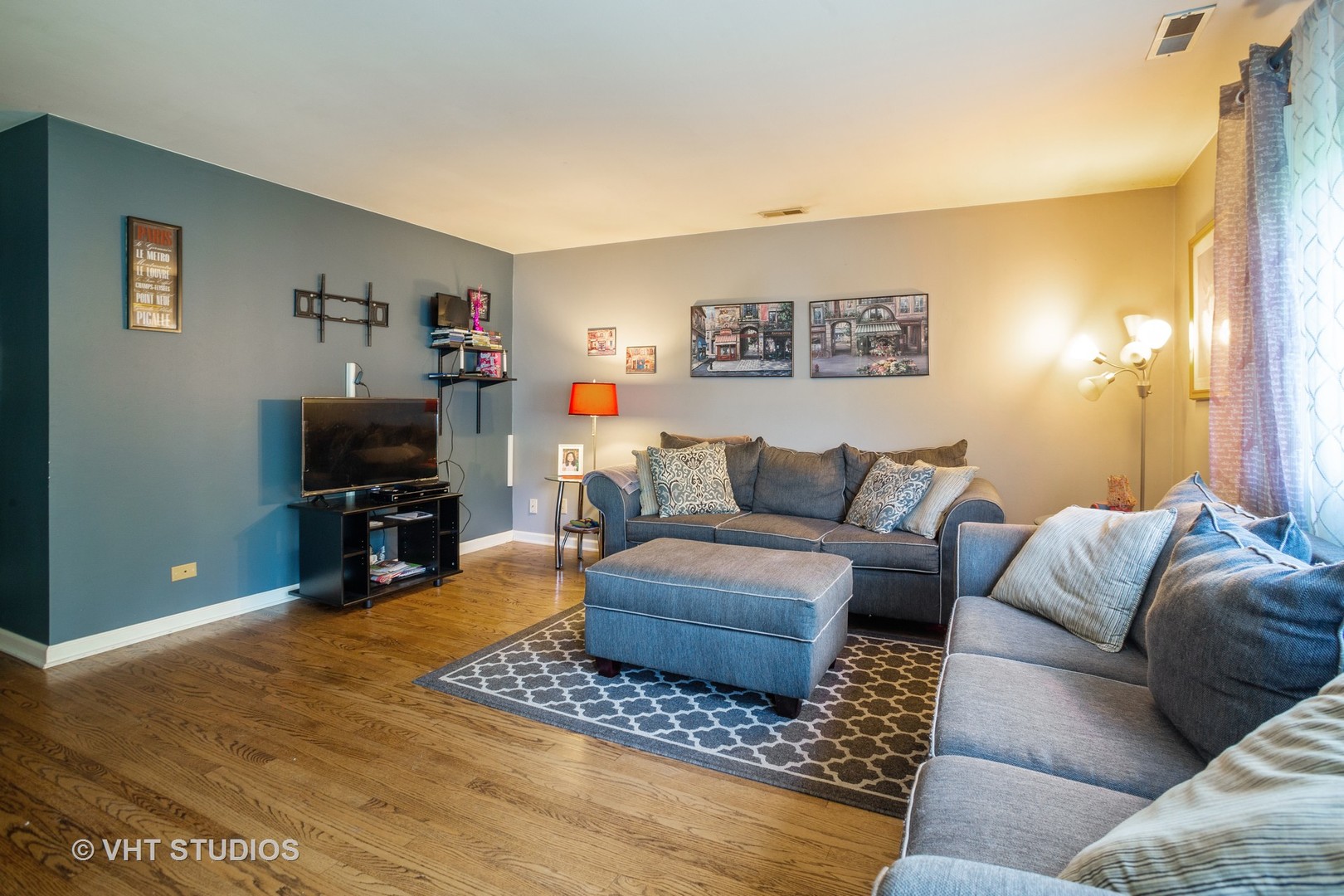 1710 Pierce Road Hoffman Estates, IL 60169 - Photo 4 of 12 a living room with furniture and a flat screen tv