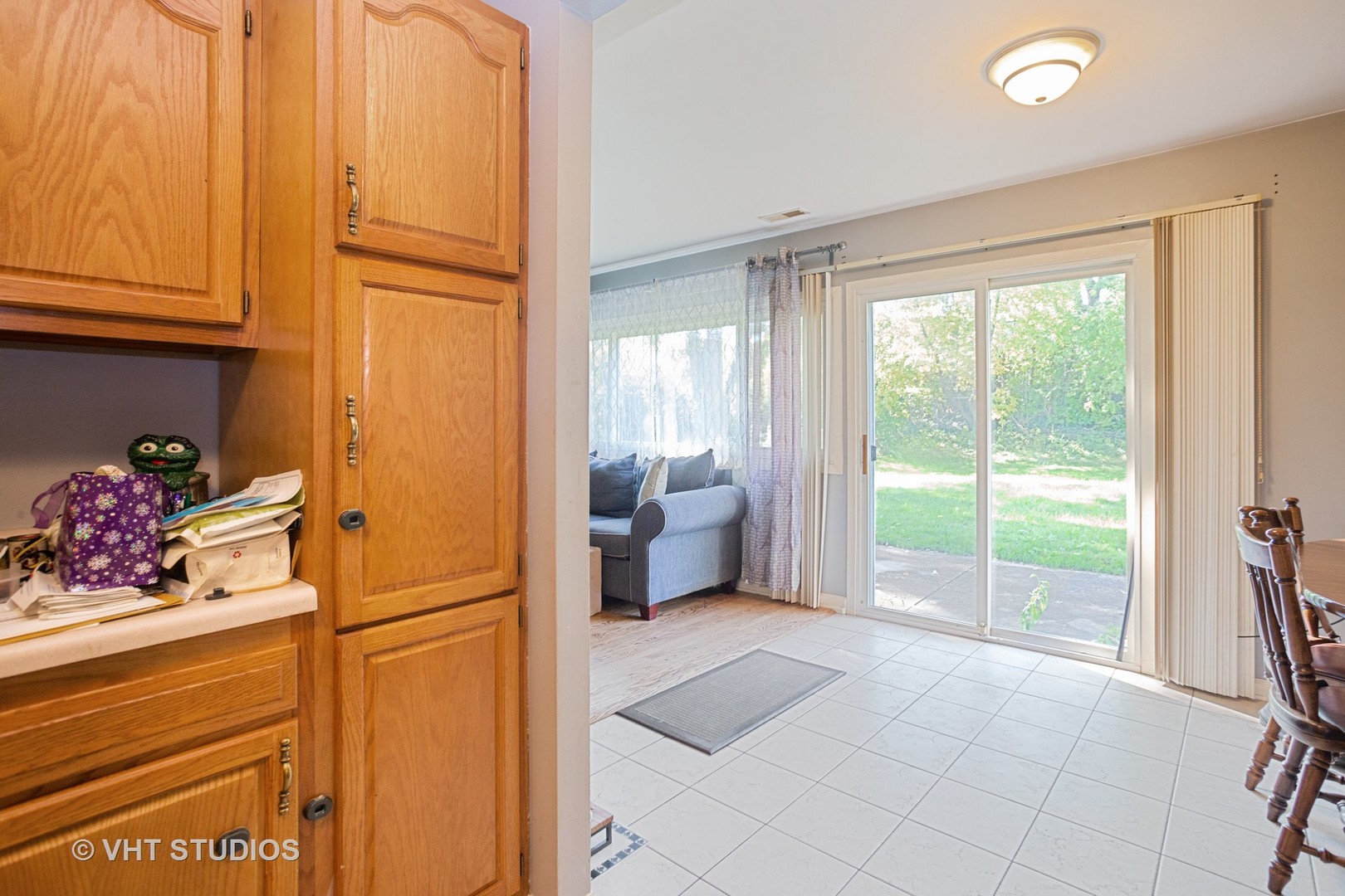 1710 Pierce Road Hoffman Estates, IL 60169 - Photo 6 of 12 a spacious bedroom with a balcony a bed and a couch