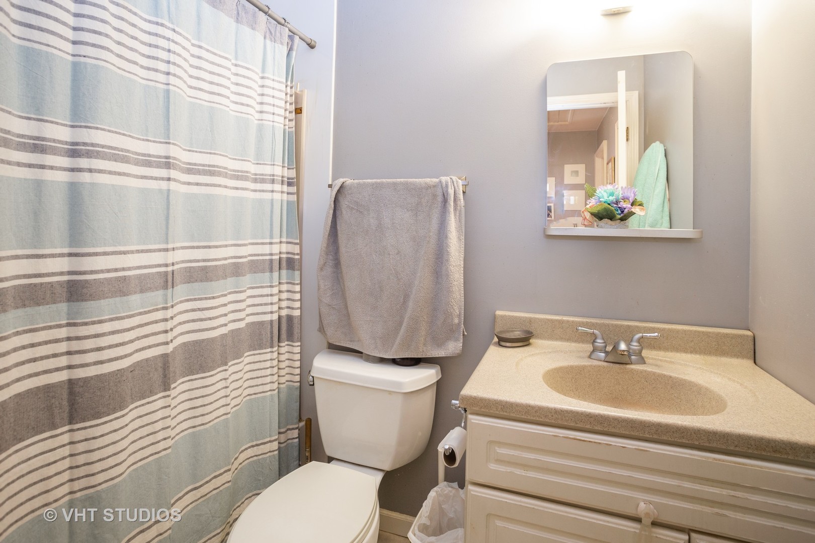 1710 Pierce Road Hoffman Estates, IL 60169 - Photo 10 of 12 a bathroom with a sink a toilet and shower