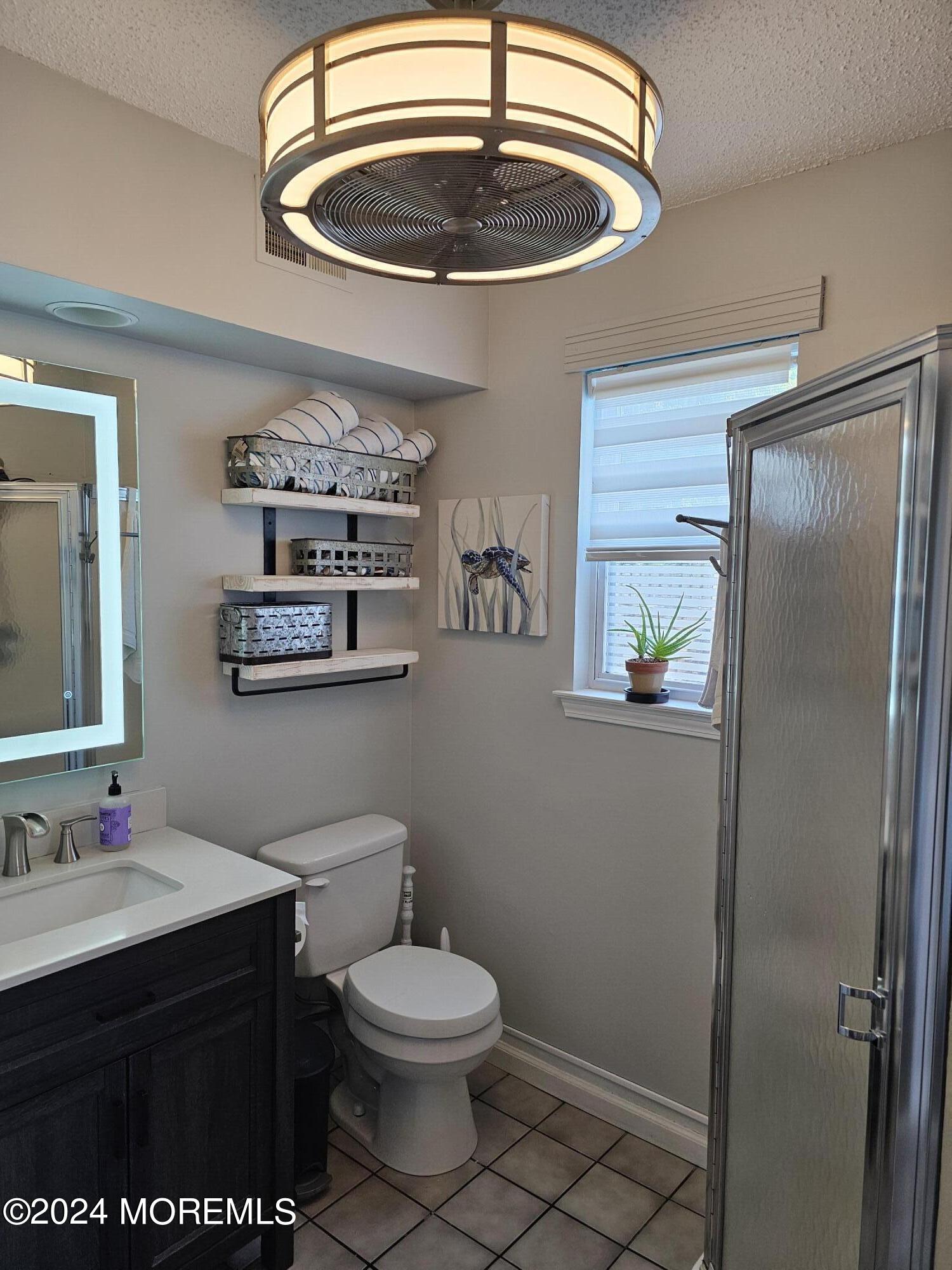 26 Capitol Reef Road Howell, NJ 07731 - Photo 19 of 41 a bathroom with a sink toilet and vanity