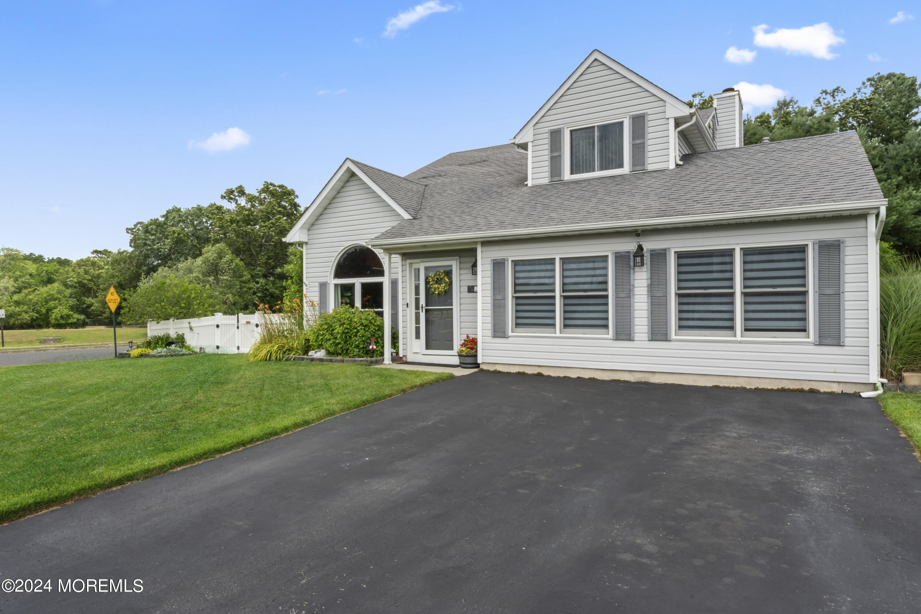 26 Capitol Reef Road Howell, NJ 07731 - Photo 35 of 41 a front view of a house with a yard and garage