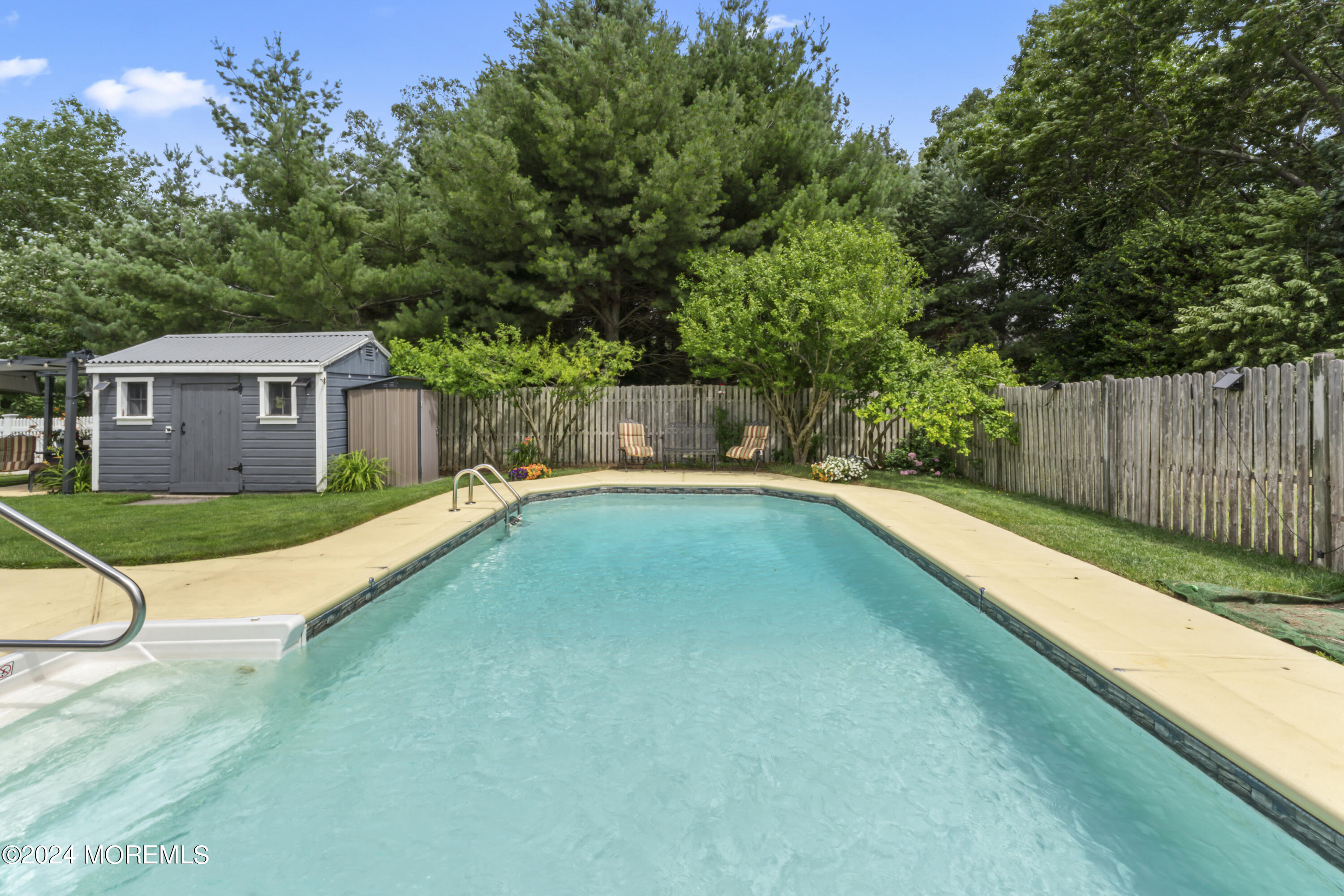 26 Capitol Reef Road Howell, NJ 07731 - Photo 4 of 41 a view of a house with a swimming pool