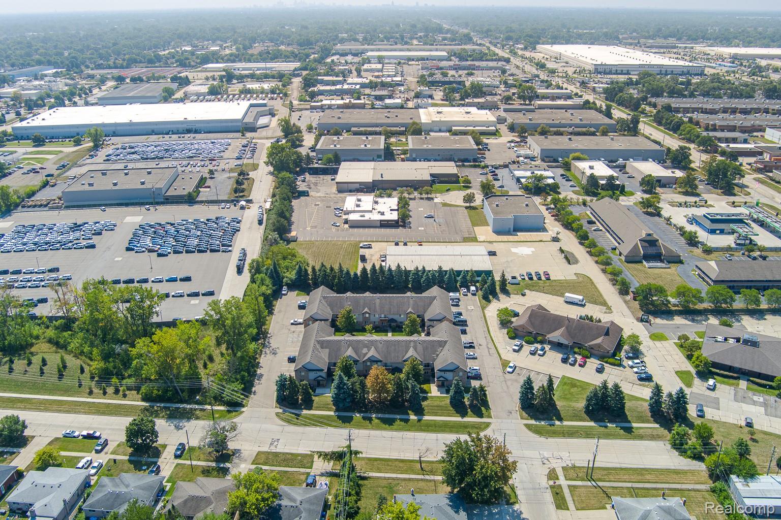 2154 Frazho Road Warren, MI 48091 - Photo 33 of 36 Aerial perspective showcasing a commercial district with a variety of building types and extensive parking areas