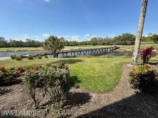 a view of a lake with houses in the back