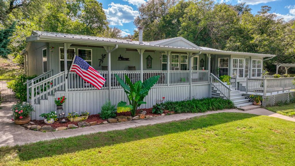 1240 Riverview Road Millsap, TX 76066 - Photo 12 of 36 a front view of a house with garden