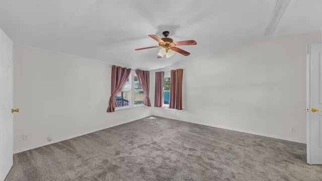wooden floor in an empty room and a bathroom
