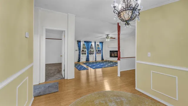 a view of empty room with ceiling fan