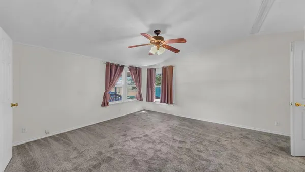 wooden floor in an empty room and a bathroom