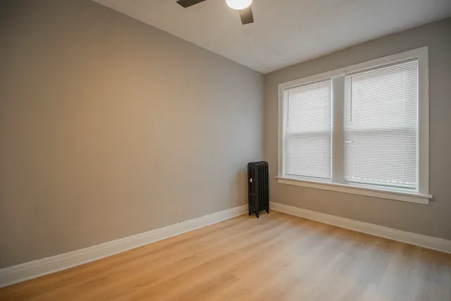 wooden floor and window in an empty room