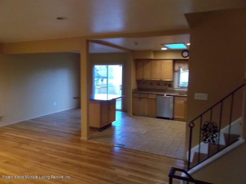 1 Sarno Street Colonia, NJ 07067 - Photo 6 of 30 a view of kitchen with microwave refrigerator and wooden floor