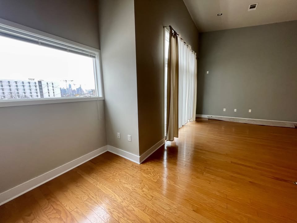 1702 South Lamar Boulevard, Unit 2 Austin, TX 78704 - Photo 12 of 25 Unfurnished room featuring plenty of natural light and light wood-style floors