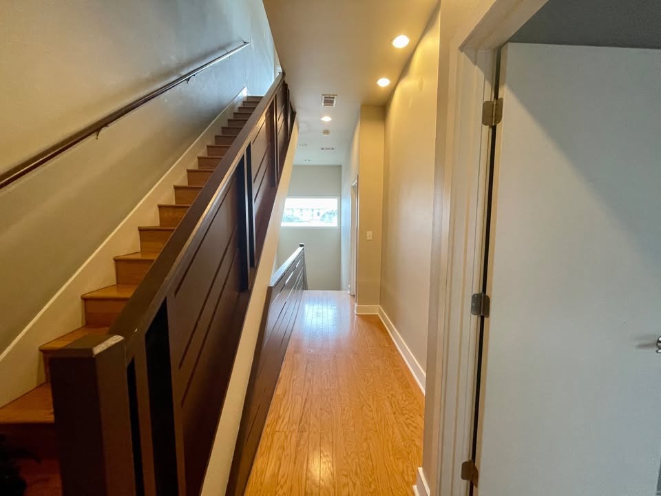 1702 South Lamar Boulevard, Unit 2 Austin, TX 78704 - Photo 15 of 25 Stairway with wood finished floors and recessed lighting