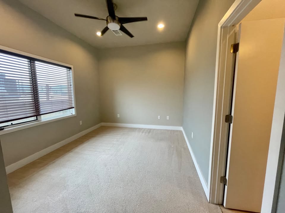 1702 South Lamar Boulevard, Unit 2 Austin, TX 78704 - Photo 22 of 25 Empty room featuring light colored carpet, a ceiling fan, and recessed lighting