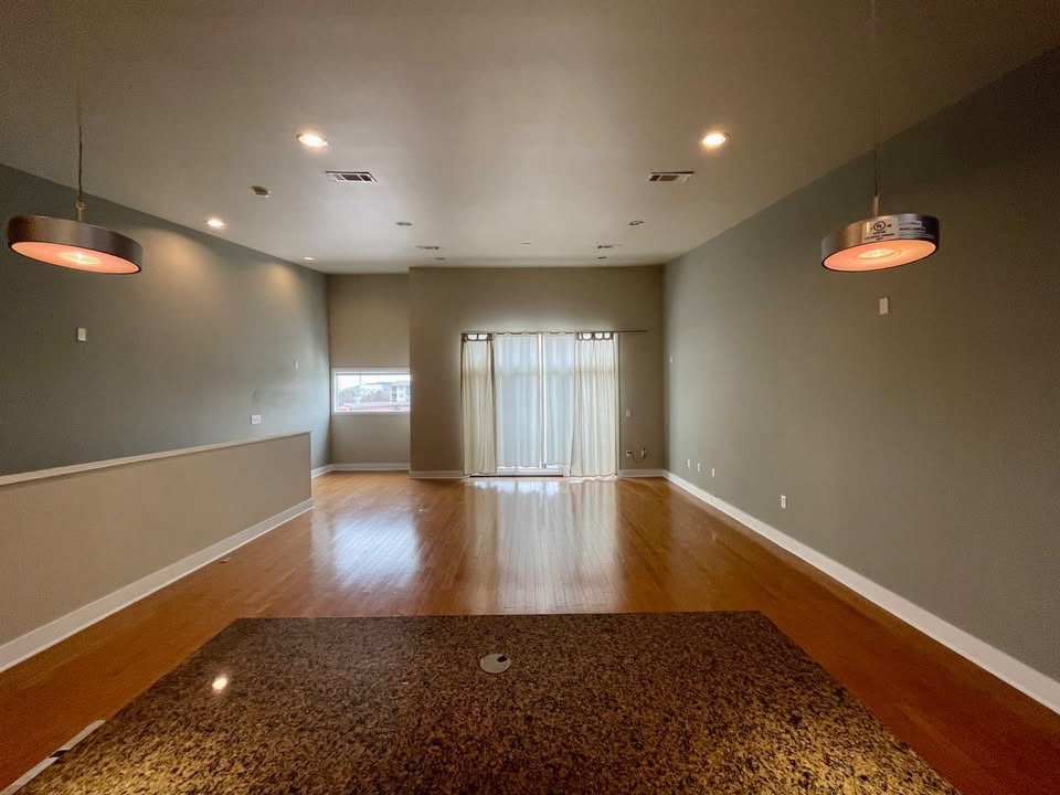 1702 South Lamar Boulevard, Unit 2 Austin, TX 78704 - Photo 10 of 25 Spare room with wood finished floors and recessed lighting
