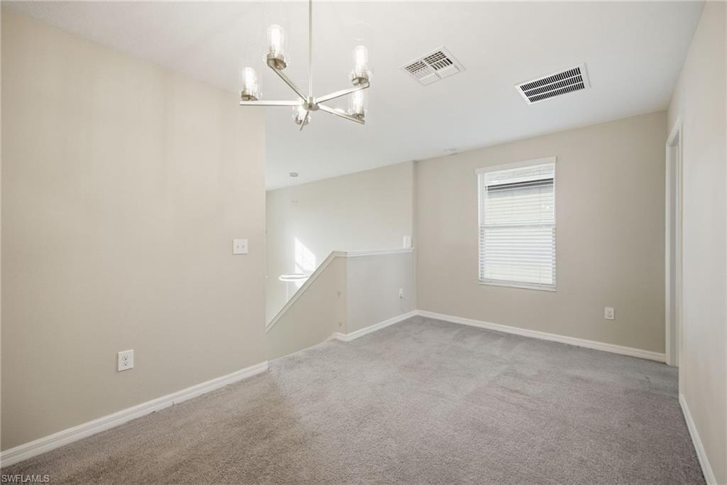 9612 Lemon Drop Loop Sun City Center, FL 33573 - Photo 10 of 33 a view of an empty room with a window