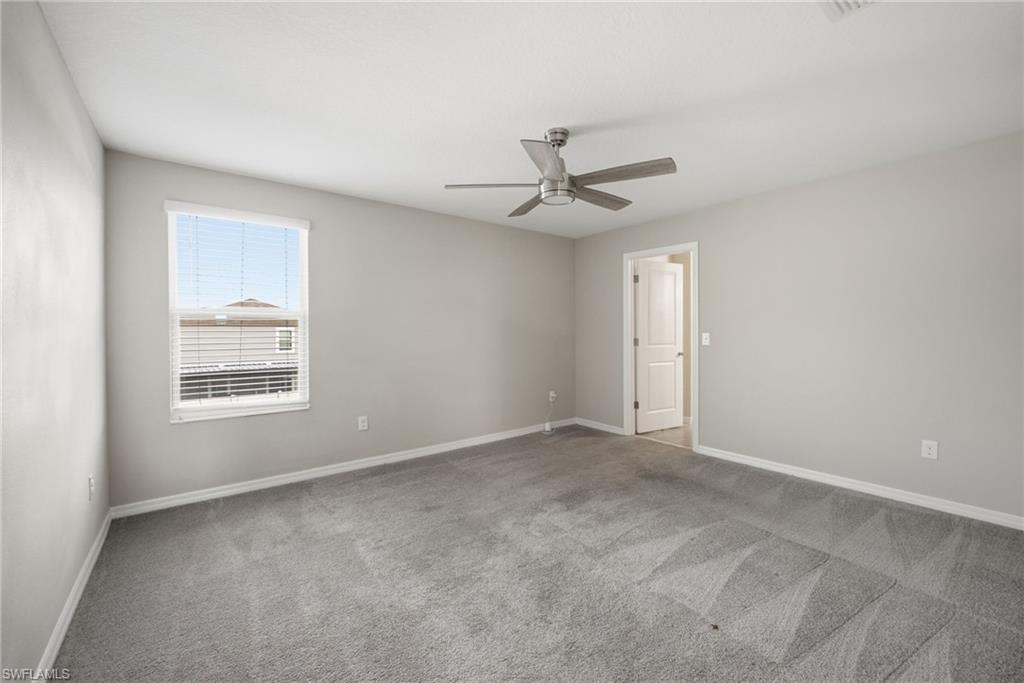 9612 Lemon Drop Loop Sun City Center, FL 33573 - Photo 17 of 33 a view of an empty room with a window