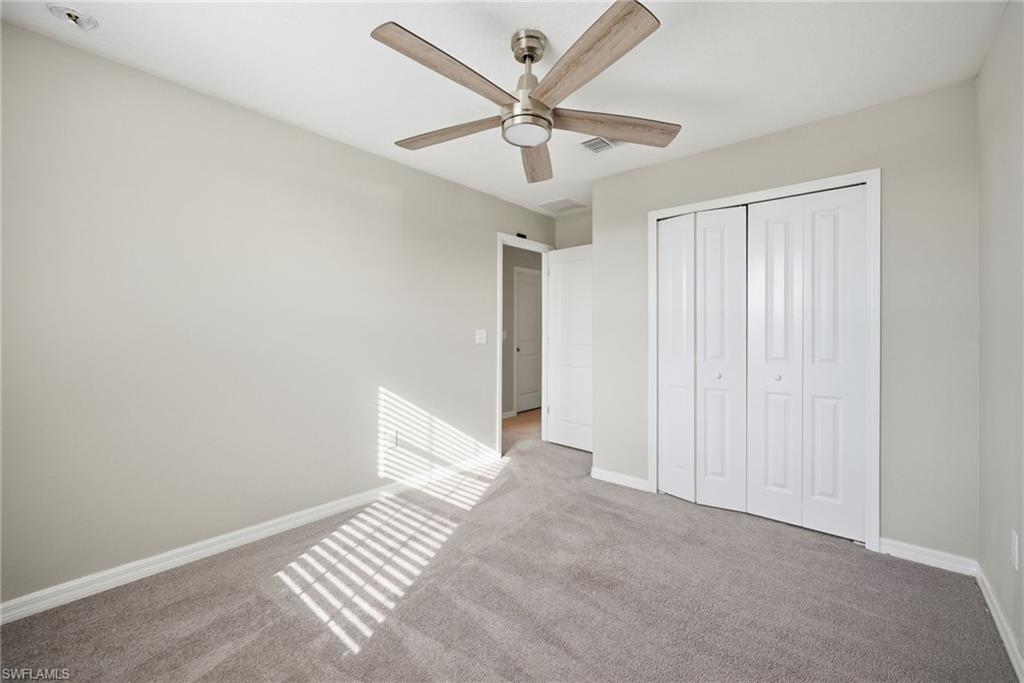 9612 Lemon Drop Loop Sun City Center, FL 33573 - Photo 19 of 33 wooden floor in an empty room
