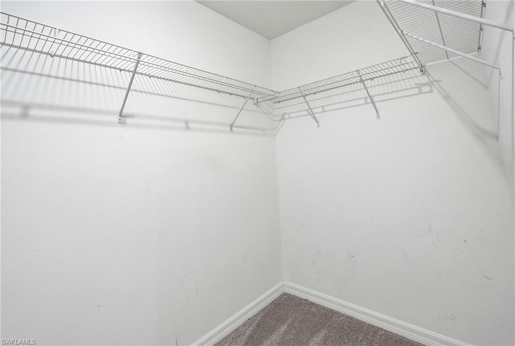 9612 Lemon Drop Loop Sun City Center, FL 33573 - Photo 21 of 33 a view of a room with racks on the wall