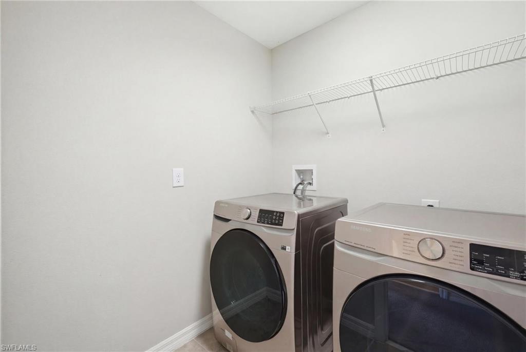 9612 Lemon Drop Loop Sun City Center, FL 33573 - Photo 24 of 33 a utility room with dryer and washer