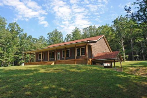 569 Sam Reed Road Northwest Floyd, VA 24091 - Photo 1 of 22 a view of a house with a backyard