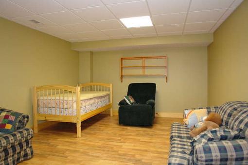 569 Sam Reed Road Northwest Floyd, VA 24091 - Photo 13 of 22 a bedroom with a bed and a tv