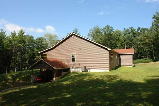 569 Sam Reed Road Northwest Floyd, VA 24091 - Photo 4 of 22 a view of a house with yard and a garden