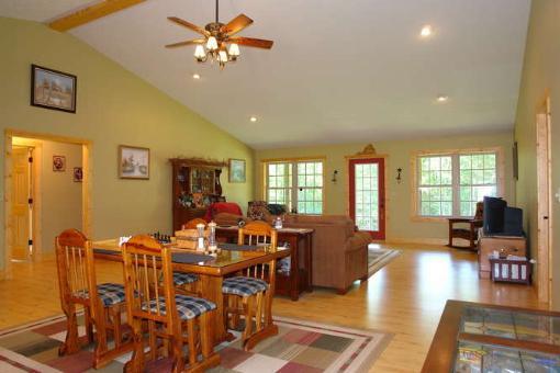 569 Sam Reed Road Northwest Floyd, VA 24091 - Photo 8 of 22 a view of a dining room with furniture window and wooden floor