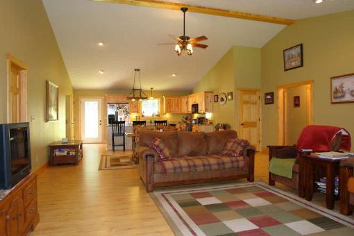 569 Sam Reed Road Northwest Floyd, VA 24091 - Photo 9 of 22 a living room with lots of furniture and a view of kitchen