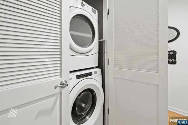 a close view of a utility room with dryer and washer
