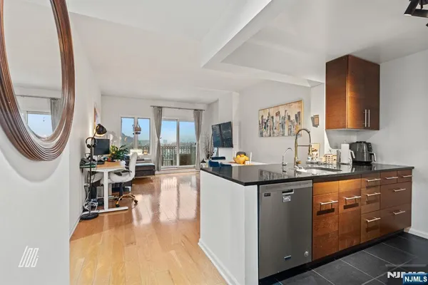 a kitchen with a sink and a stove top oven