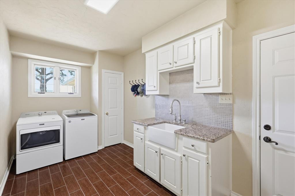 6955 Hawk Road Flower Mound, TX 75022 - Photo 26 of 40 Utility room featuring wood-finish flooring, a farmhouse sink with a gooseneck faucet, light-toned countertops, white cabinetry, and a window