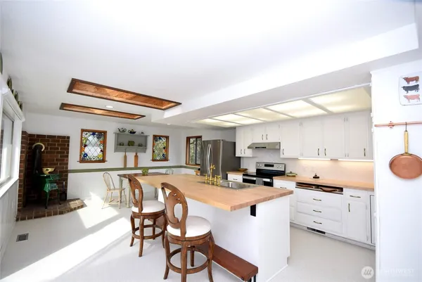a kitchen with cabinets and window