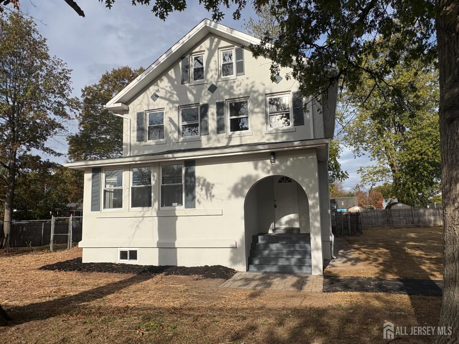 111 Doyle Street Piscataway, NJ 08854 - Photo 2 of 18 a front view of a house with a yard