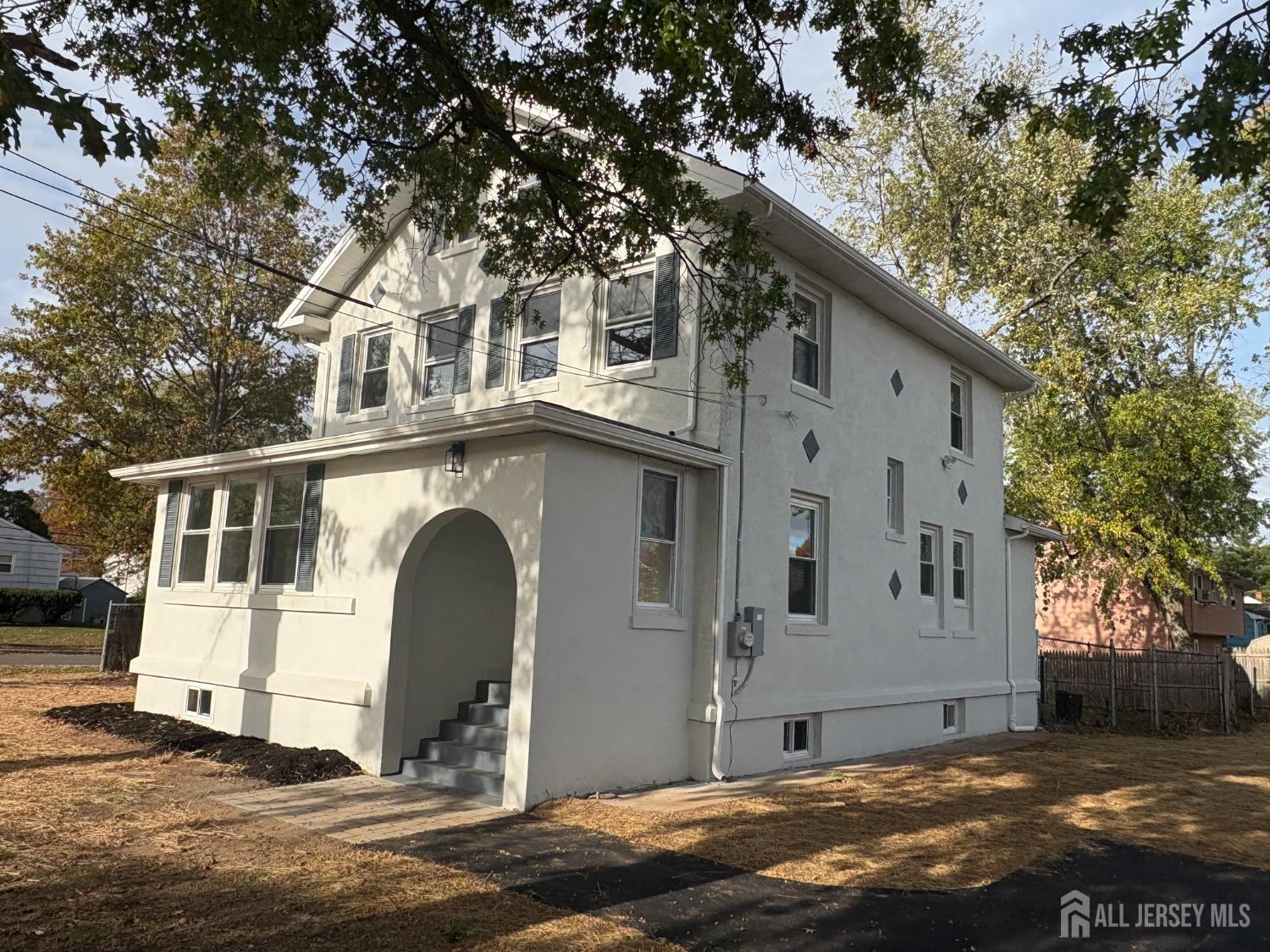 111 Doyle Street Piscataway, NJ 08854 - Photo 3 of 18 a front view of a house with a yard
